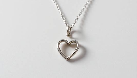 Unleash Your Inner Fashionista: Discover the Stunning Stainless Steel Twist Hollow Heart Pendant Necklace