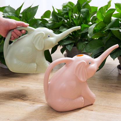 Baby elephant watering flowers Garden DealSniper.net