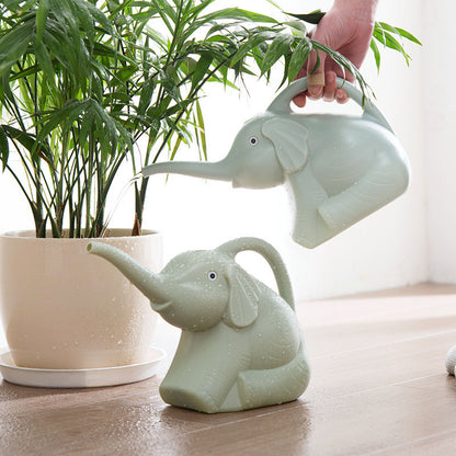 Baby elephant watering flowers Garden DealSniper.net