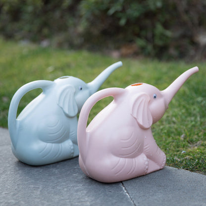 Baby elephant watering flowers Garden DealSniper.net