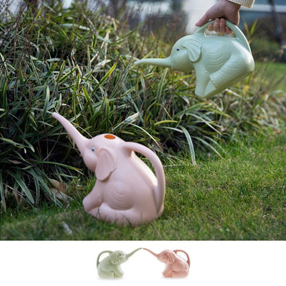 Baby elephant watering flowers Garden DealSniper.net